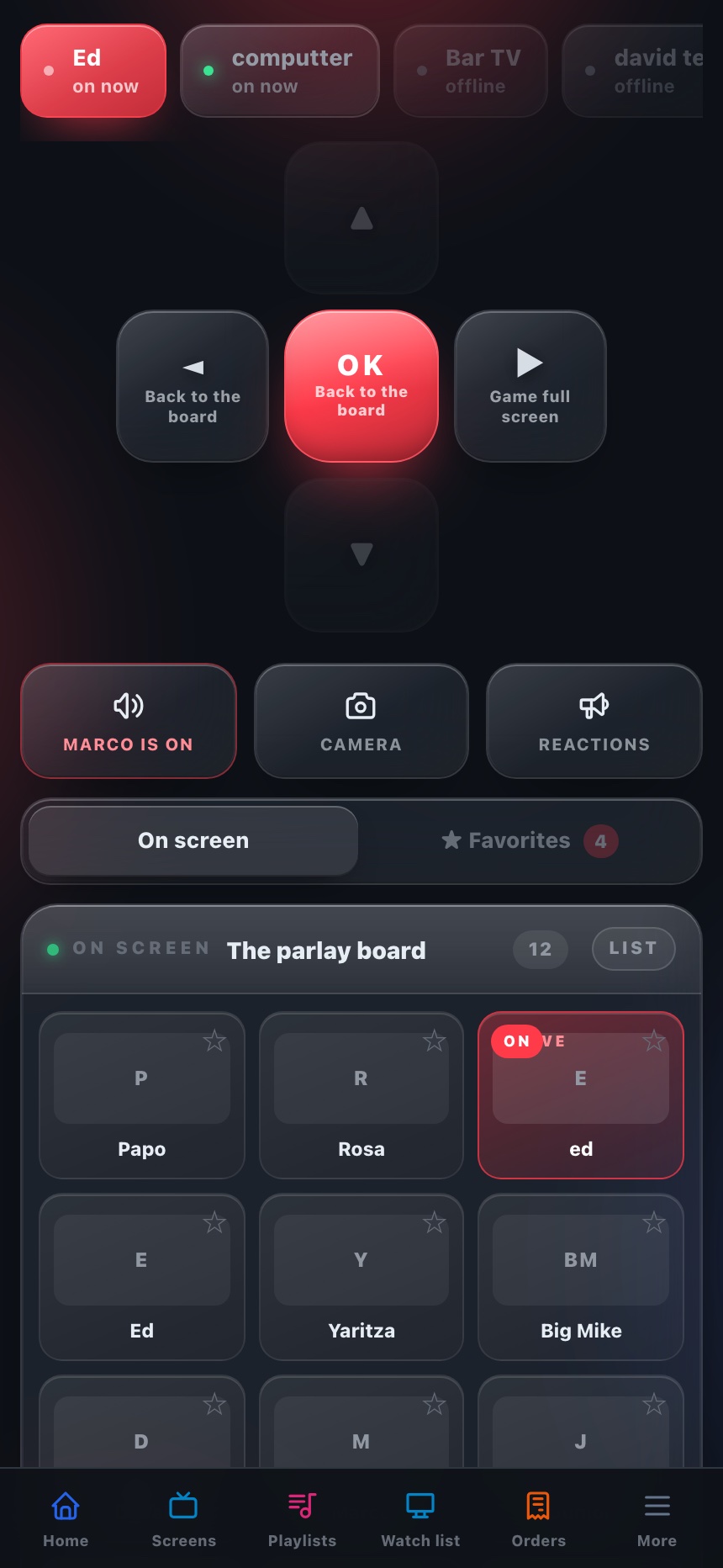 The staff handset on the parlay board with Talk, Camera and Reactions keys and a tray of six emoji